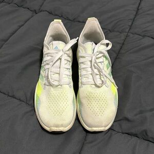 Adidas Women’s tennis shoe, Size 8 1/2, white Neon Yellow and blue in color.